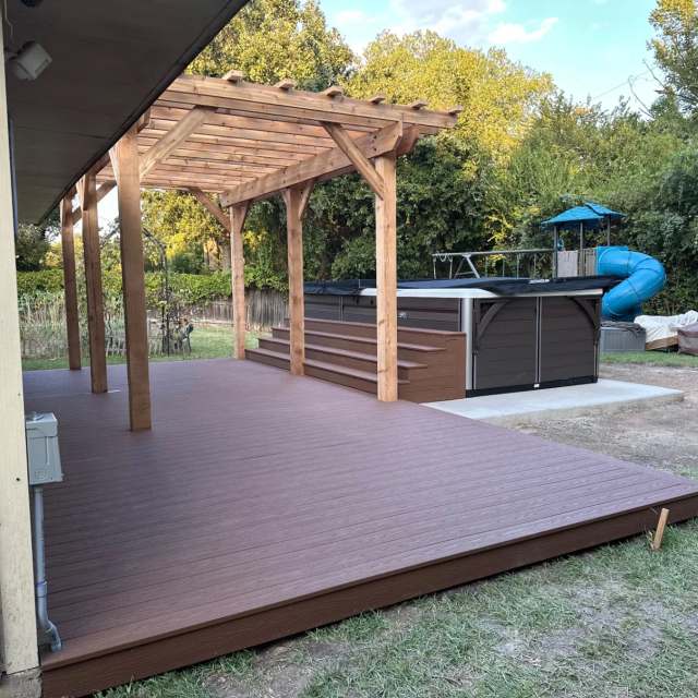 Finished composite deck, pergola and pool spa from the house