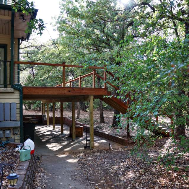 Elevated deck creating a covered patio space underneath in Grandview, TX