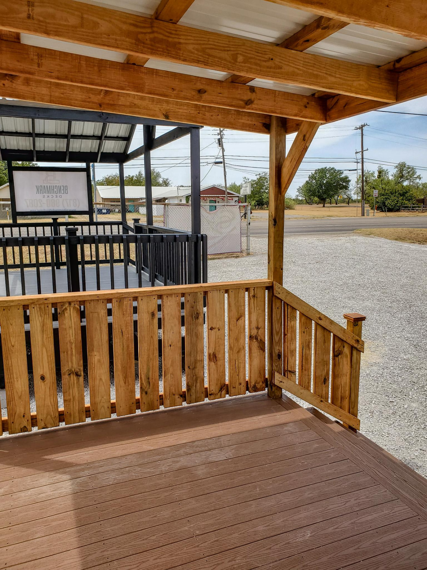 Stained composite deck with cedar railing available rent to own