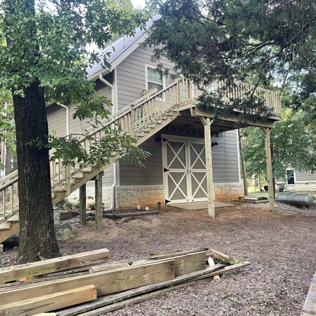 Second-story deck with switchback stairs and railing built by BenchMark Decks
